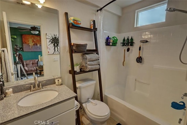 full bath with ceiling fan, toilet, vanity, visible vents, and shower / tub combo with curtain