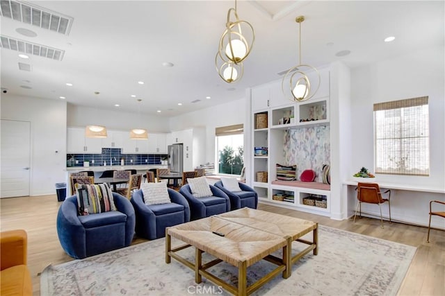 7082 Mallow Dr Unit 4, Fontana, CA 92336 - living room featuring light wood finished floors and recessed lighting