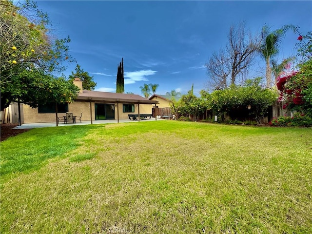 view of yard featuring a patio area and fence