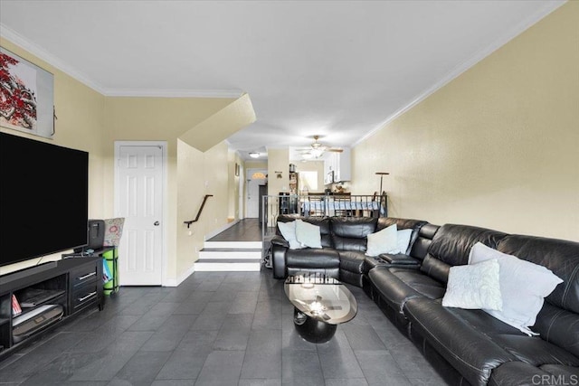 living area with baseboards, ceiling fan, stairway, and crown molding