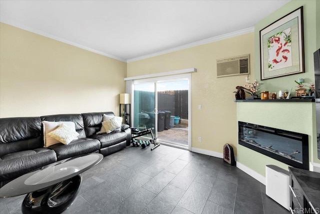 living area with ornamental molding, a wall mounted AC, a glass covered fireplace, and baseboards