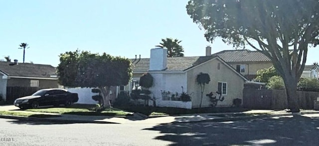 view of front of home with a chimney