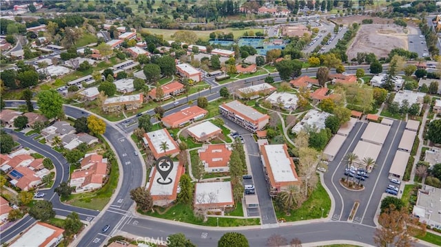 birds eye view of property with a residential view