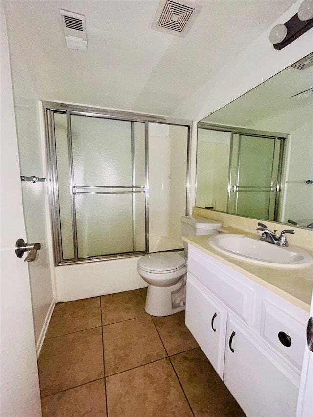 full bath featuring visible vents, vanity, toilet, and tile patterned floors