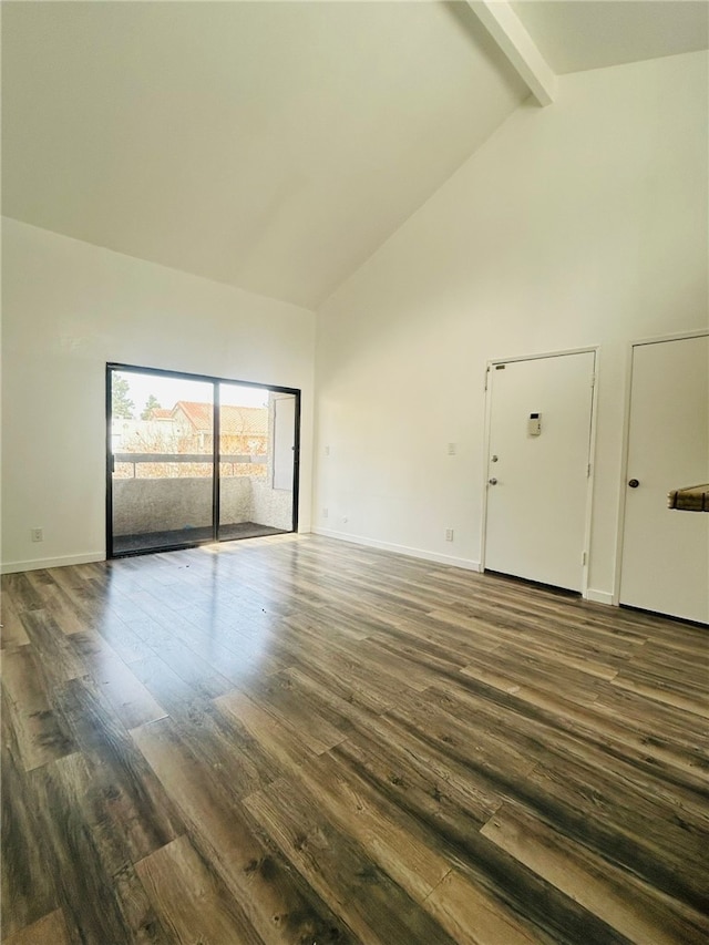 interior space featuring baseboards, high vaulted ceiling, beamed ceiling, and dark wood-style flooring