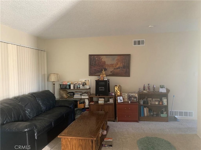 2665 Millet Ave, El Monte, CA 71733 - carpeted living room with visible vents and a textured ceiling