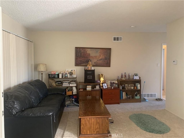 2665 Millet Ave, El Monte, CA 71733 - living area with light carpet, visible vents, and a textured ceiling