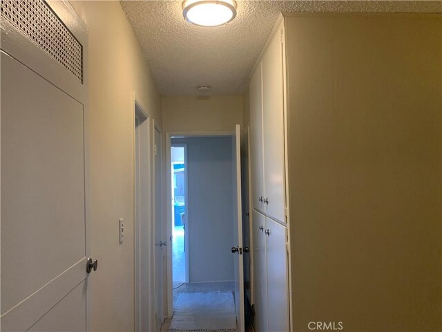 2665 Millet Ave, El Monte, CA 71733 - corridor featuring a textured ceiling