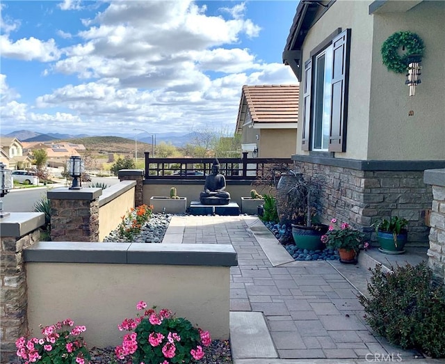 view of patio / terrace with a mountain view