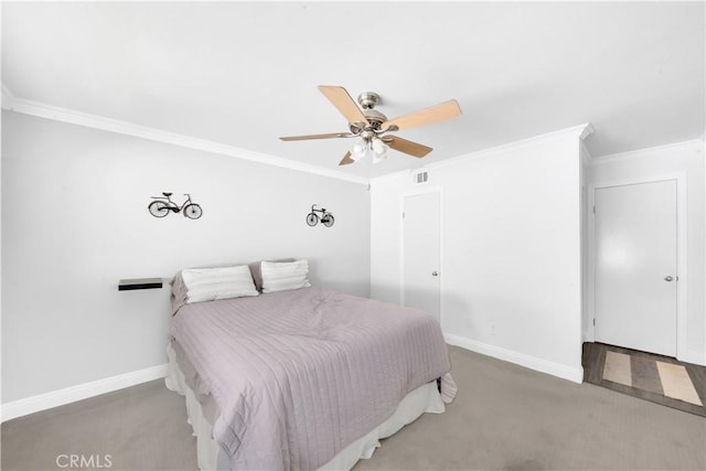 bedroom with carpet, visible vents, ornamental molding, ceiling fan, and baseboards