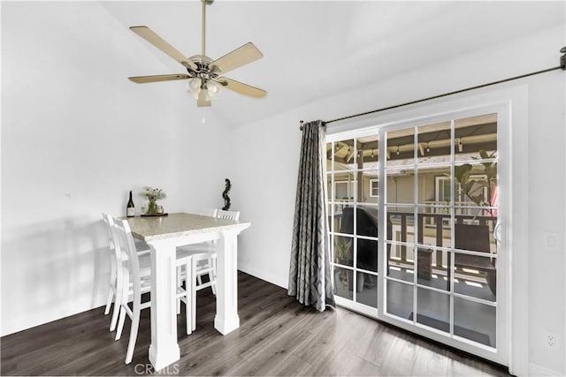 dining room featuring lofted ceiling, ceiling fan, and wood finished floors