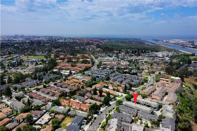 drone / aerial view with a water view and a residential view