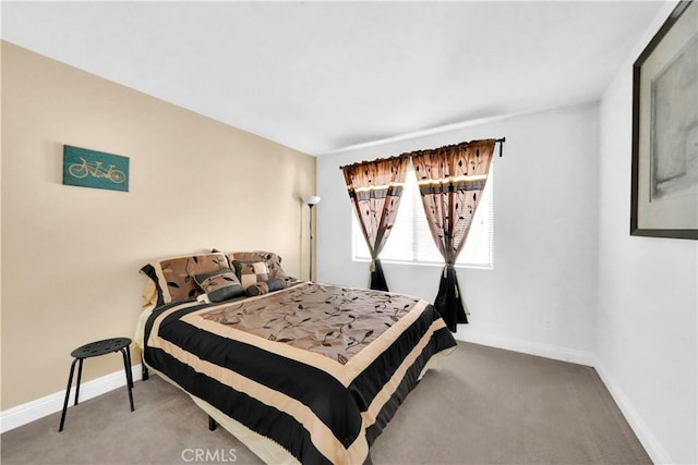 carpeted bedroom with baseboards