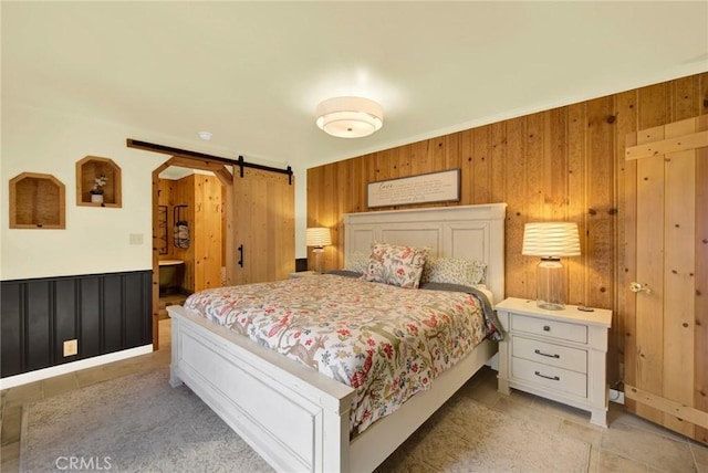 24891 Tehama Vina, Los Molinos, CA 96055 - bedroom featuring wainscoting and a barn door