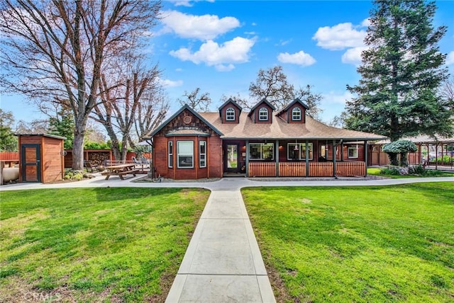 24891 Tehama Vina, Los Molinos, CA 96055 - view of front of home with an outbuilding, fence, a front lawn, and a shed