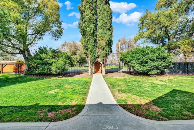 24891 Tehama Vina, Los Molinos, CA 96055 - view of property's community featuring a fenced front yard, a gate, and a yard