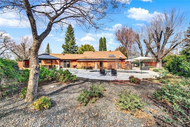24891 Tehama Vina, Los Molinos, CA 96055 - rear view of house with a patio area and fence