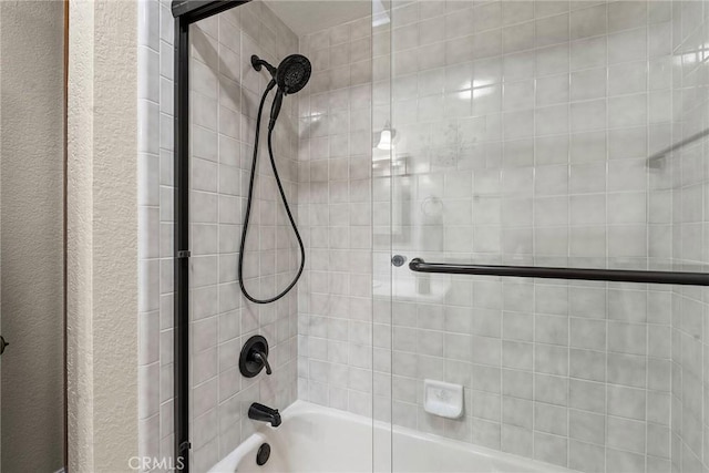 full bath featuring shower / bath combination with glass door