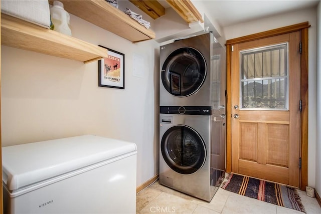 7716 Sunset Rd, Joshua Tree, CA 92252 - laundry area featuring light tile patterned floors, laundry area, and stacked washer / dryer