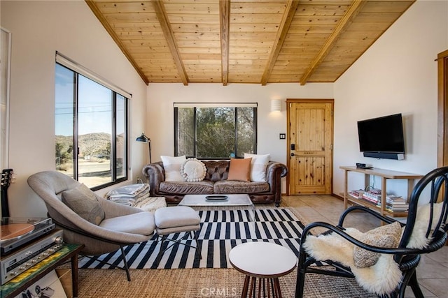 7716 Sunset Rd, Joshua Tree, CA 92252 - living room with light tile patterned flooring, lofted ceiling with beams, and wooden ceiling