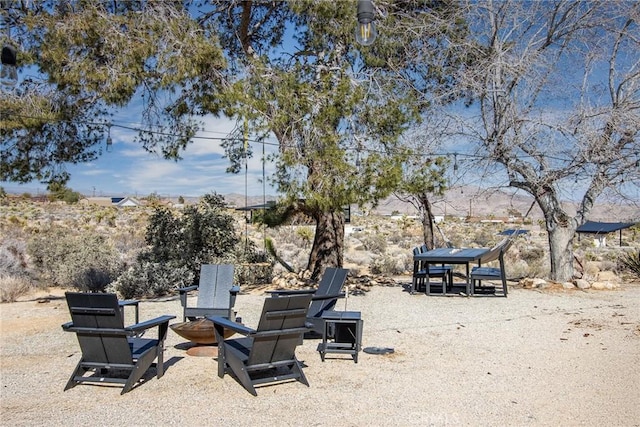 7716 Sunset Rd, Joshua Tree, CA 92252 - view of yard featuring a fire pit