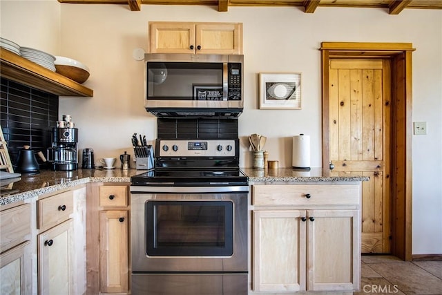 7716 Sunset Rd, Joshua Tree, CA 92252 - kitchen featuring light brown cabinetry, decorative backsplash, appliances with stainless steel finishes, and stone counters