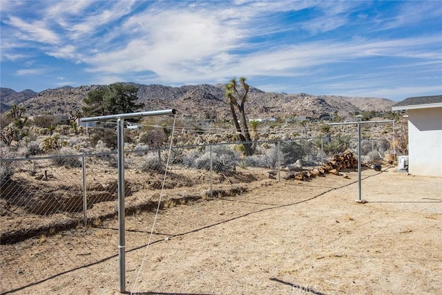 7716 Sunset Rd, Joshua Tree, CA 92252 - view of yard featuring fence and a mountain view
