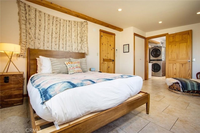 7716 Sunset Rd, Joshua Tree, CA 92252 - bedroom featuring tile patterned floors, stacked washer and clothes dryer, recessed lighting, and beam ceiling