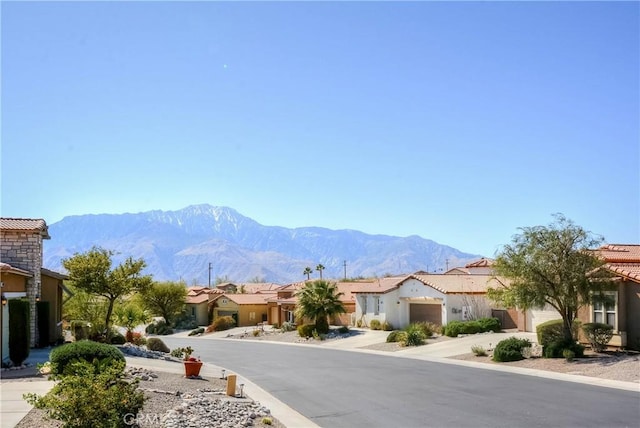 view of road with a mountain view and a residential view