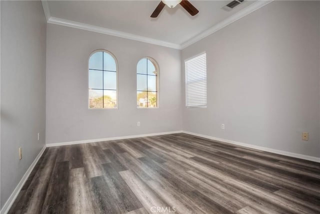 unfurnished room with dark wood-style flooring, visible vents, ornamental molding, a ceiling fan, and baseboards