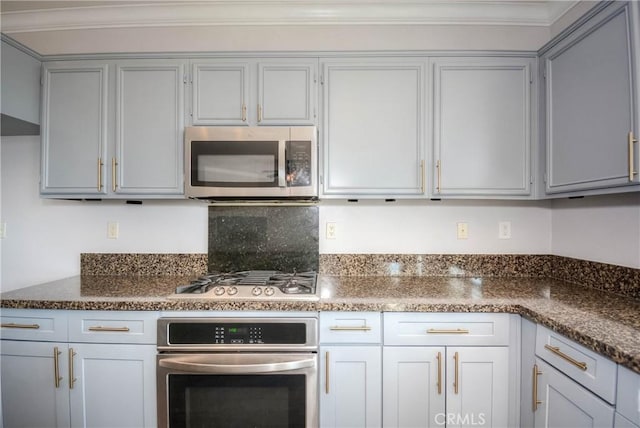 kitchen featuring gray cabinets, stainless steel appliances, and crown molding