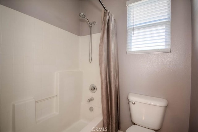 full bath with shower / tub combo and toilet