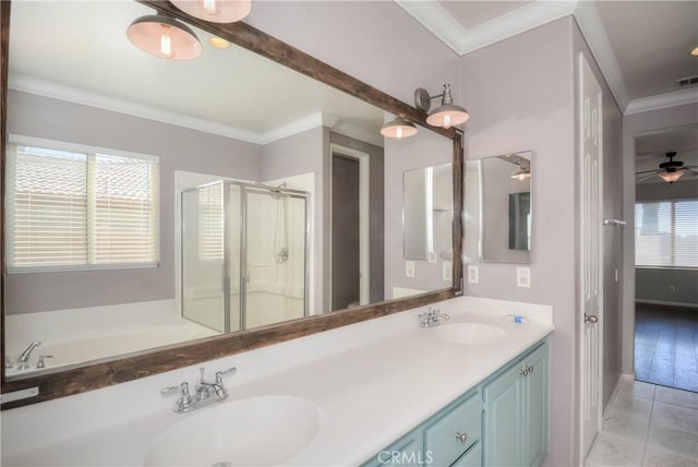 full bath featuring ornamental molding, a stall shower, tile patterned flooring, and a sink