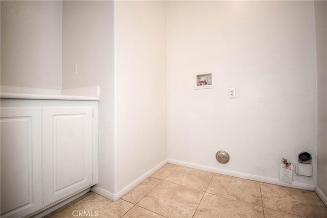 laundry room with gas dryer hookup, light tile patterned flooring, laundry area, washer hookup, and baseboards