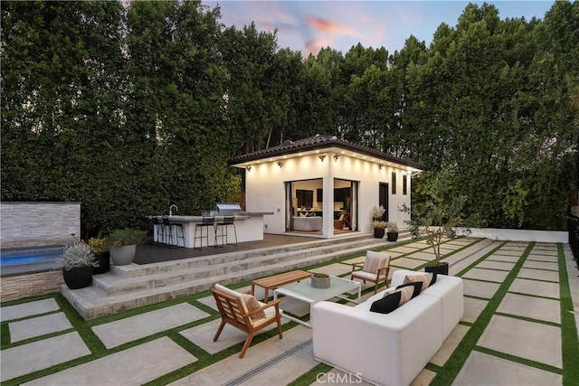 view of patio with an outdoor structure, outdoor dry bar, and an outdoor hangout area