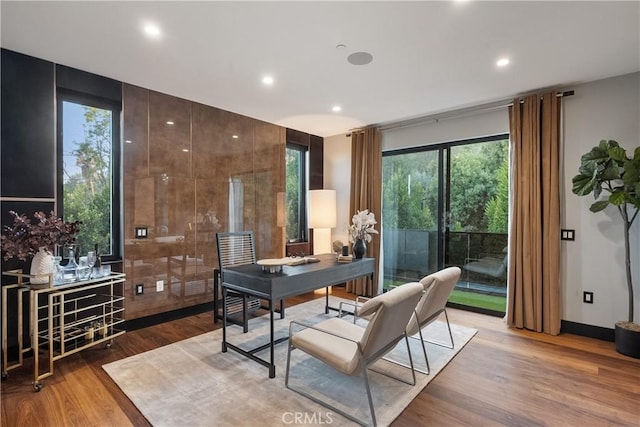 office area with baseboards, light wood-type flooring, and recessed lighting