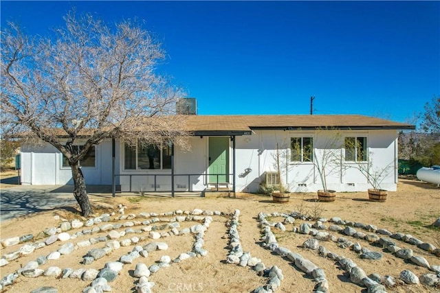 rear view of house featuring crawl space