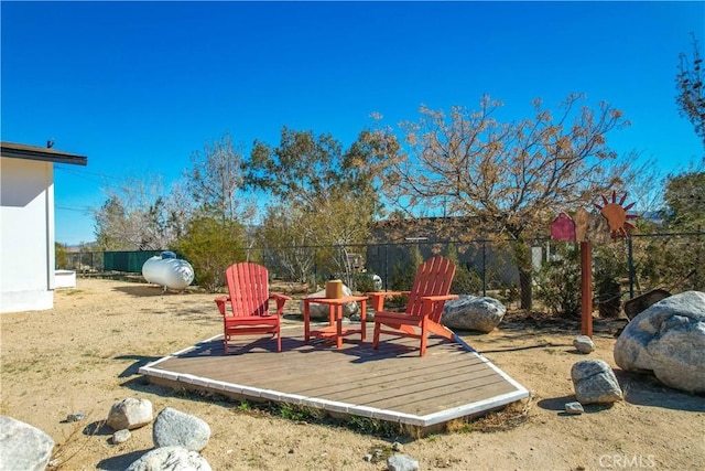 view of yard with a fenced backyard and a wooden deck