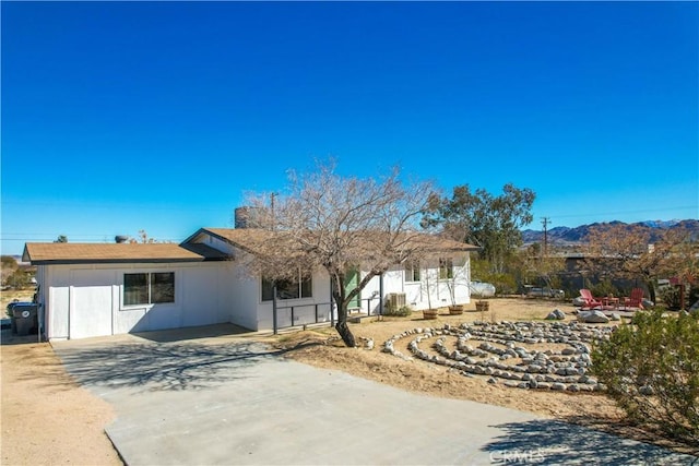 single story home with concrete driveway