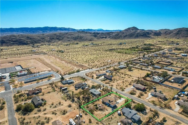 aerial view with view of desert, a rural view, and a mountain view