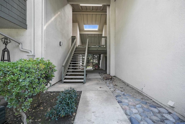 entrance to property featuring stucco siding