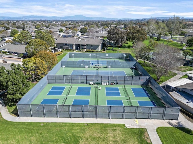 drone / aerial view featuring a residential view and a mountain view