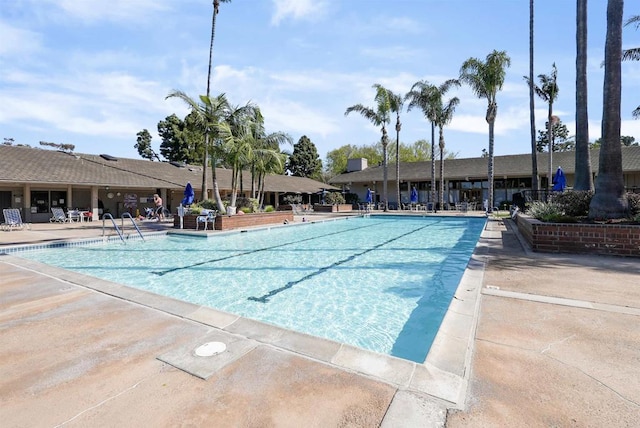 community pool with a patio