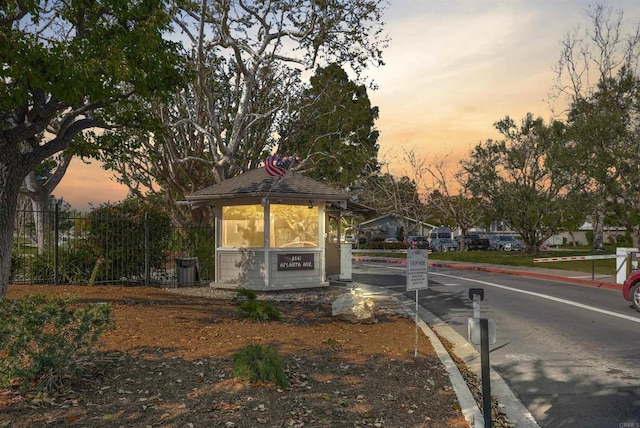 view of front of home featuring fence