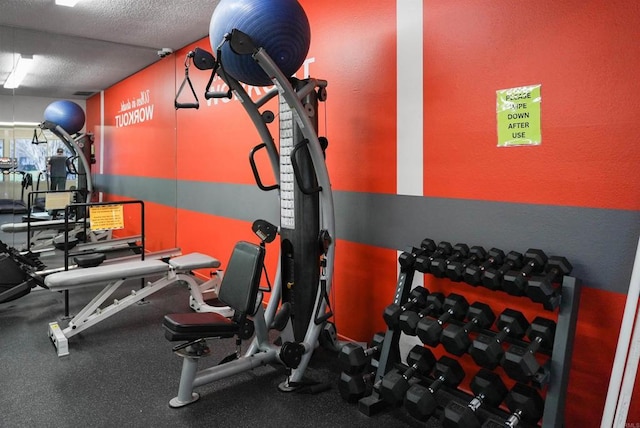 gym featuring a textured ceiling