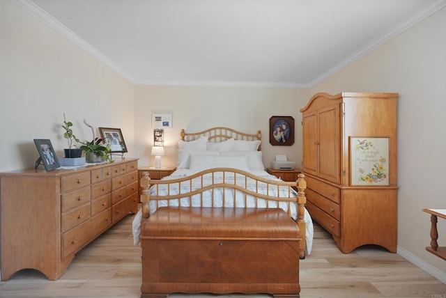 bedroom featuring light wood-type flooring, baseboards, and ornamental molding