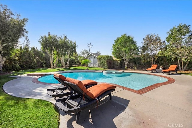 view of pool featuring a pool with connected hot tub, a patio area, a yard, and a fenced backyard