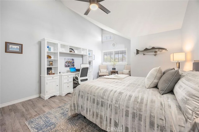 bedroom featuring high vaulted ceiling, light wood-style flooring, baseboards, and a ceiling fan