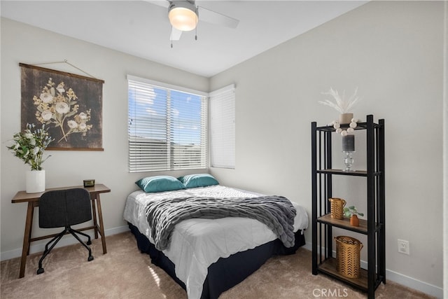 bedroom with carpet floors, baseboards, and a ceiling fan