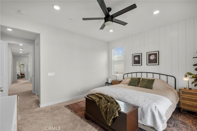 carpeted bedroom featuring ceiling fan, baseboards, and recessed lighting